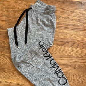 Calvin Klein sweatpants. Heather gray with black detail. Size small.